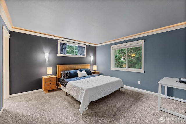 carpeted bedroom with baseboards and ornamental molding