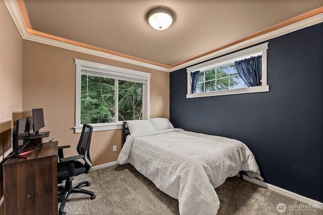 bedroom featuring crown molding, carpet flooring, and baseboards