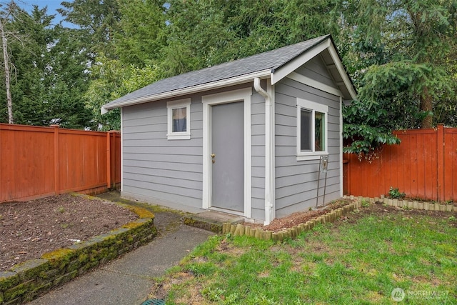 view of shed with a fenced backyard