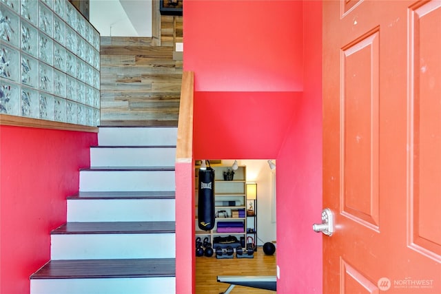 stairway with wood finished floors