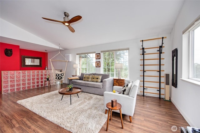 living room featuring baseboards, a ceiling fan, lofted ceiling, and wood finished floors