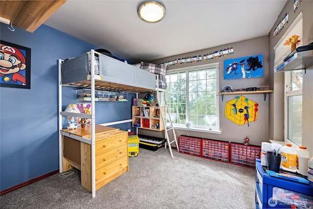 carpeted bedroom featuring baseboards