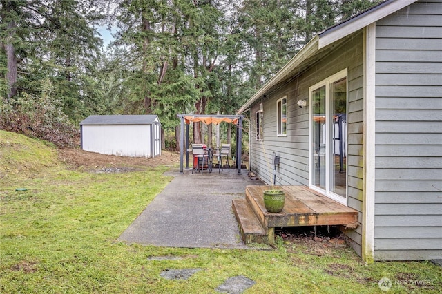 view of yard with a storage shed, a deck, and an outdoor structure