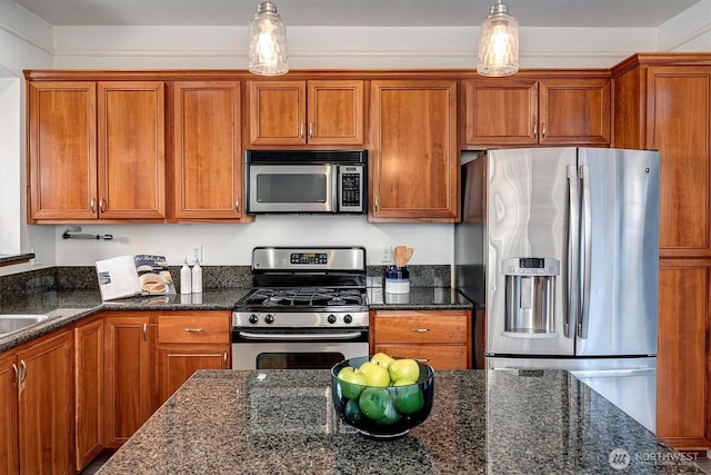 kitchen with brown cabinetry and appliances with stainless steel finishes