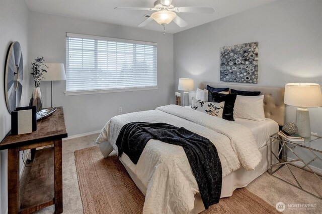 bedroom featuring baseboards and ceiling fan