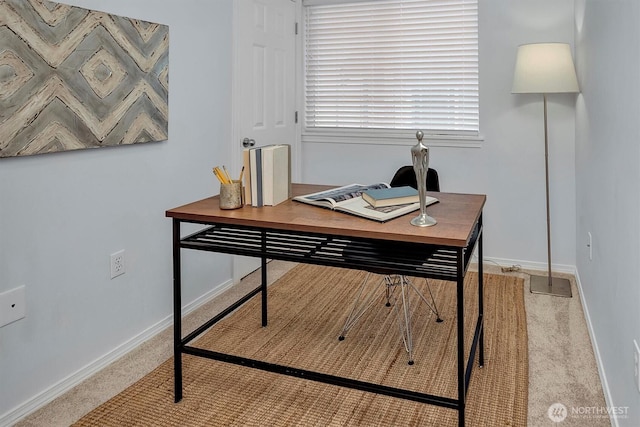 home office with baseboards and carpet floors