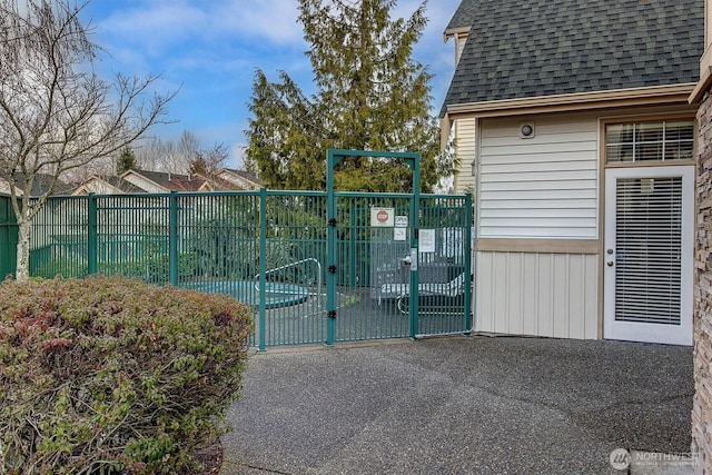 view of gate featuring fence