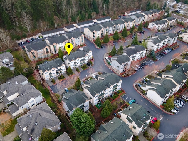 birds eye view of property with a residential view