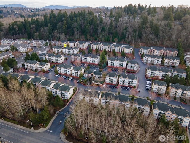 aerial view with a residential view and a view of trees