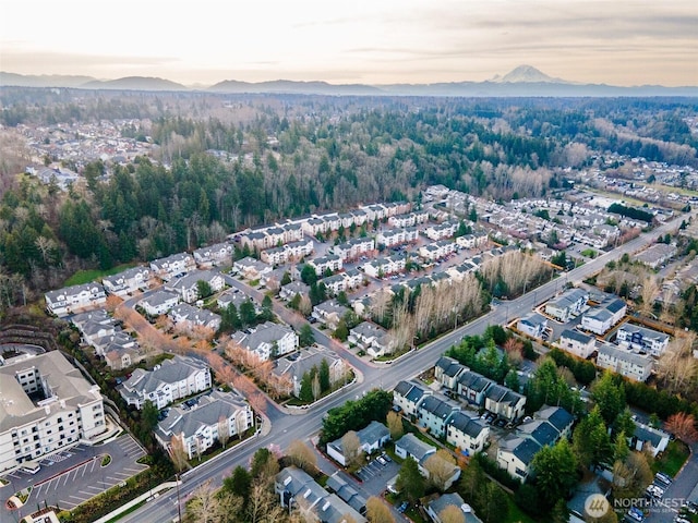 birds eye view of property with a mountain view