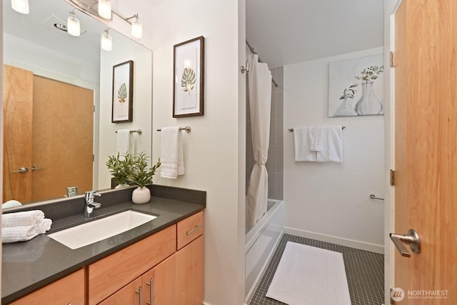 bathroom featuring vanity, tile patterned floors, shower / bathtub combination with curtain, and baseboards