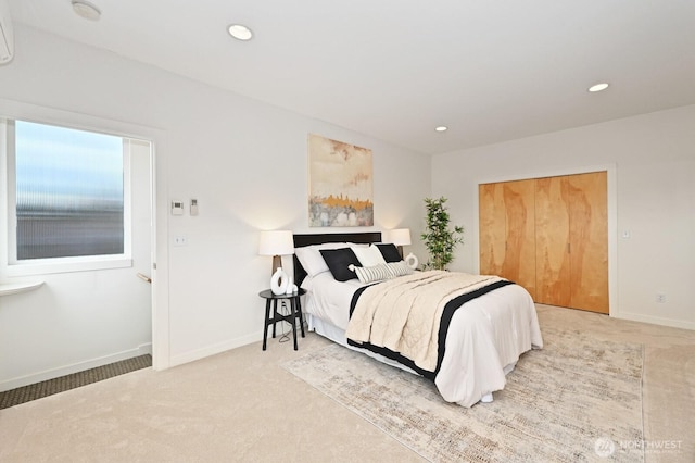 bedroom featuring recessed lighting, baseboards, and light colored carpet