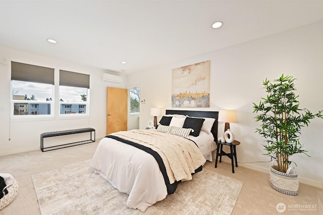 carpeted bedroom with an AC wall unit, recessed lighting, and baseboards