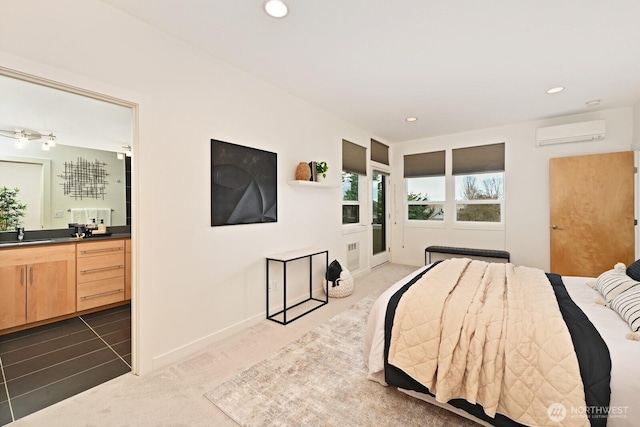 carpeted bedroom featuring recessed lighting, wet bar, a wall mounted AC, and a sink