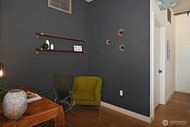 office area featuring baseboards and wood finished floors