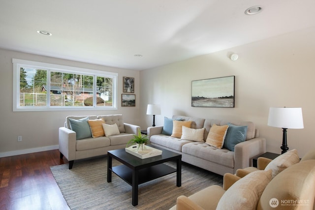 living area with recessed lighting, baseboards, and wood finished floors