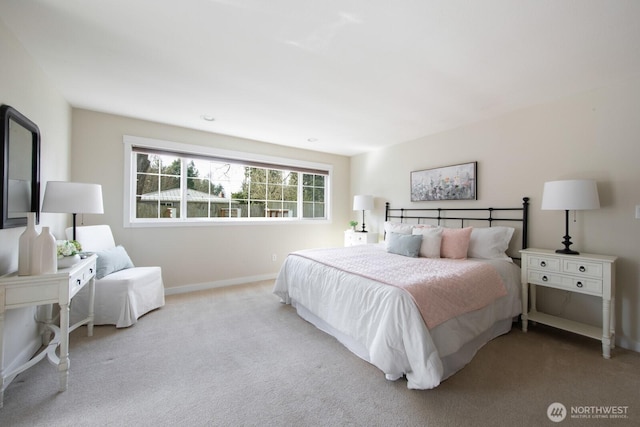 carpeted bedroom with baseboards