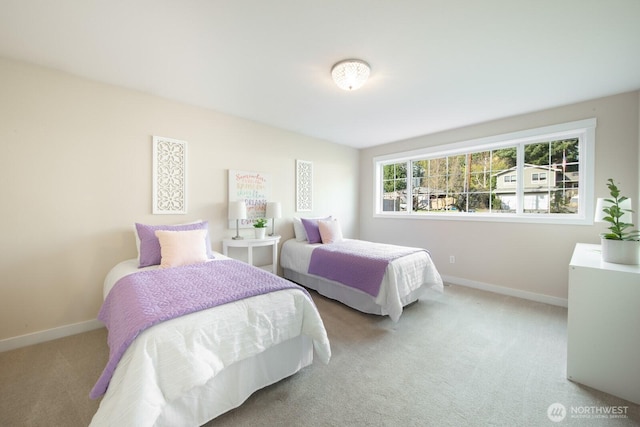 bedroom featuring baseboards and carpet flooring