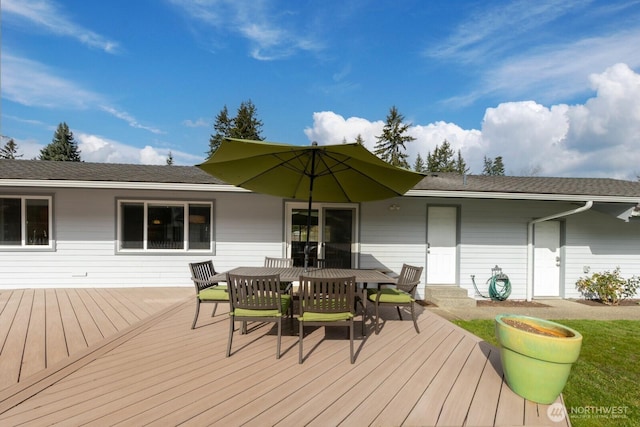 wooden terrace with outdoor dining space