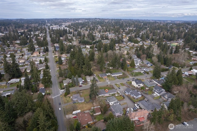 birds eye view of property with a residential view