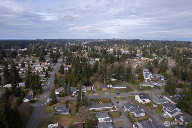 birds eye view of property with a residential view