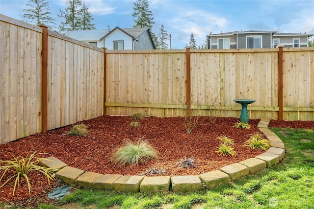 view of yard with a fenced backyard