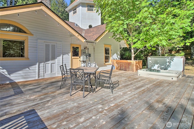 wooden terrace featuring outdoor dining area