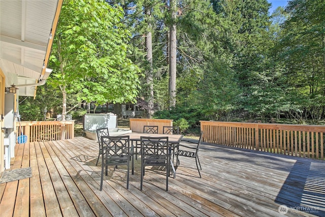 wooden deck with outdoor dining space