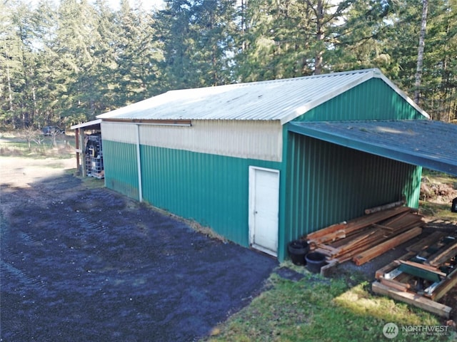 view of pole building featuring a view of trees