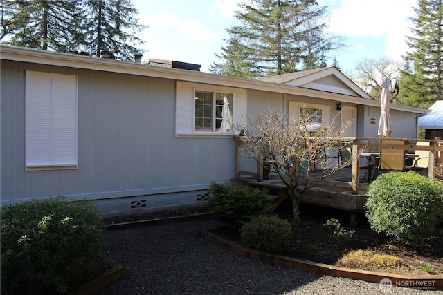 view of front facade featuring crawl space and outdoor dining space