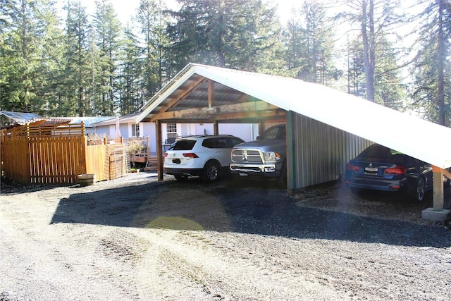 view of parking featuring a carport and driveway