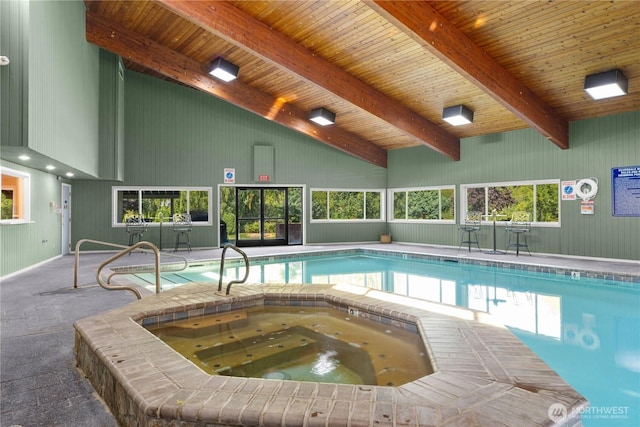 indoor pool with an indoor in ground hot tub