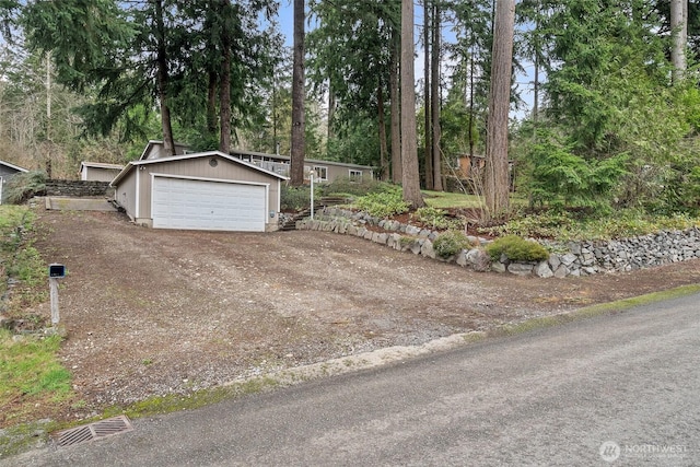 detached garage featuring visible vents