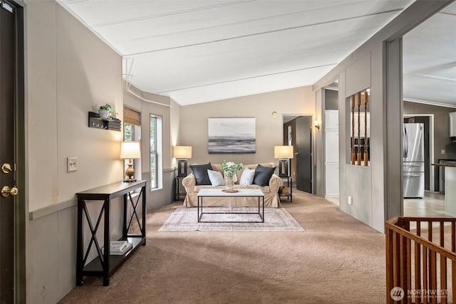 living room featuring light colored carpet and lofted ceiling