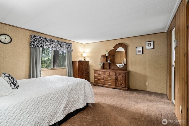 carpeted bedroom featuring crown molding