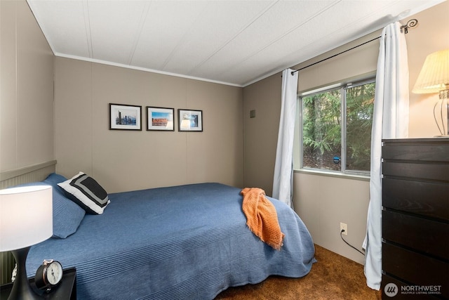 carpeted bedroom with ornamental molding