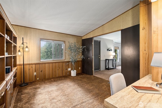 office featuring lofted ceiling, wooden walls, carpet, and wainscoting