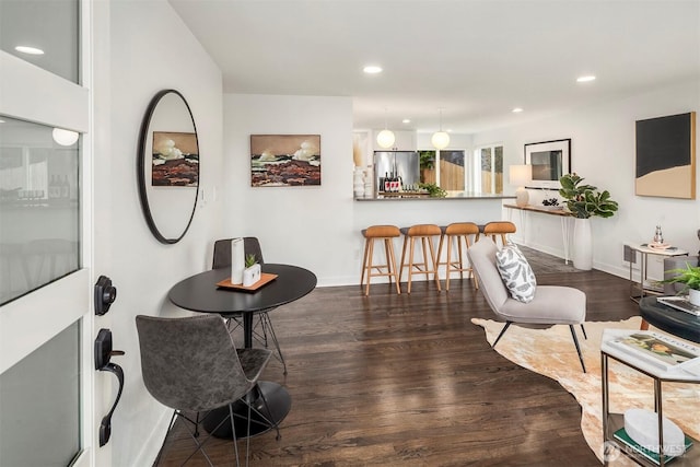 interior space with recessed lighting, baseboards, and dark wood-style floors