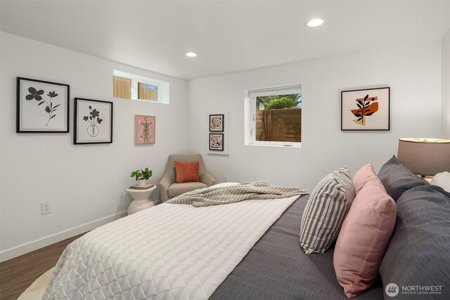 bedroom with dark wood-type flooring, recessed lighting, and baseboards