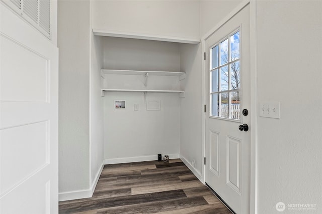 clothes washing area with visible vents, washer hookup, dark wood finished floors, baseboards, and laundry area