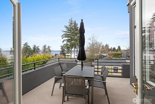 balcony featuring a water view