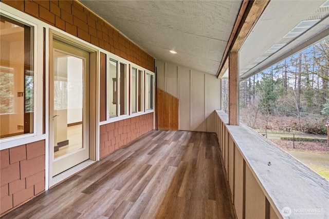 unfurnished sunroom with a wealth of natural light