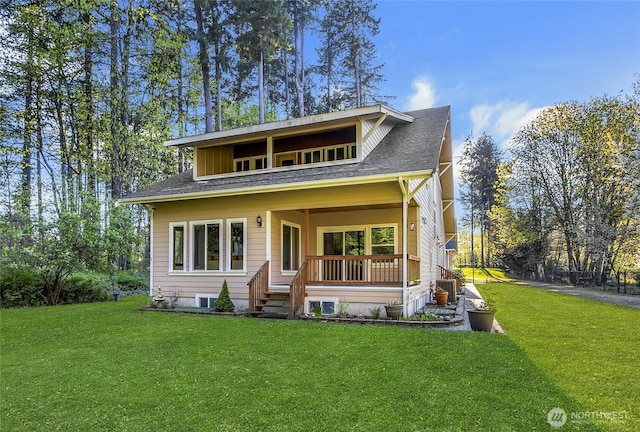 15809 Spanaway Loop Rd S, Spanaway, WA 98387 - view of front facade with a front lawn, a shingled roof, and covered porch