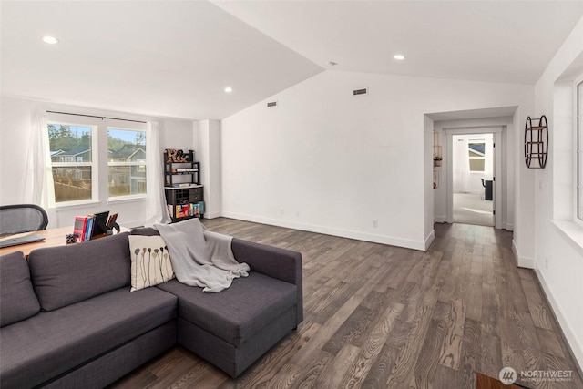 living area featuring recessed lighting, baseboards, lofted ceiling, and wood finished floors