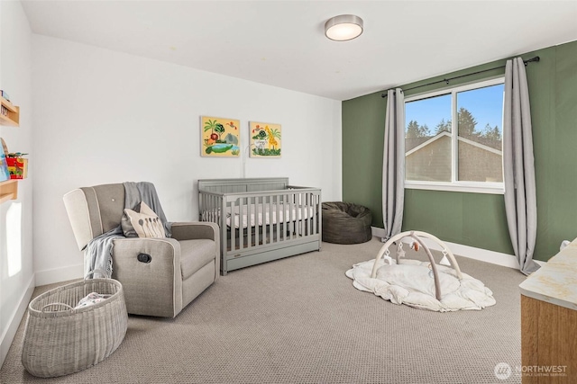 carpeted bedroom with baseboards