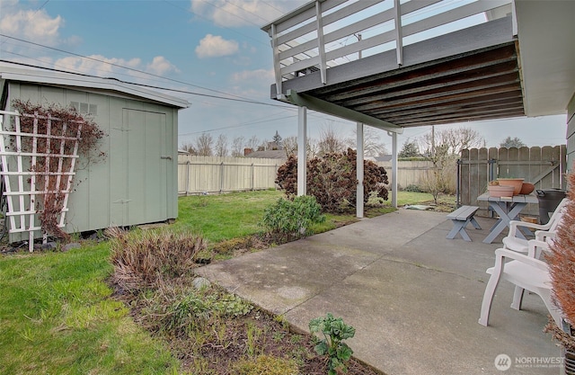 view of patio featuring a fenced backyard, a storage shed, and an outdoor structure