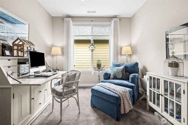 carpeted home office with visible vents, plenty of natural light, and baseboards