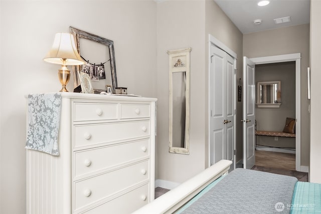 bedroom featuring visible vents, baseboards, and a closet