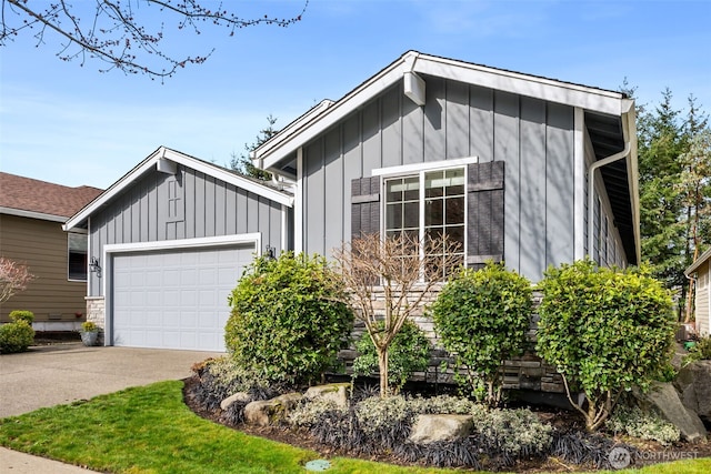 exterior space featuring a garage, board and batten siding, and driveway