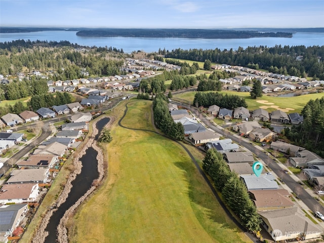 birds eye view of property with a residential view and a water view